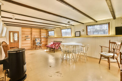 Empty chairs and tables in restaurant