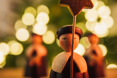 Close-up of toy hanging on wood