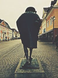 Woman standing on city street