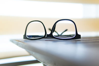 Close-up of eyeglasses on table