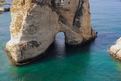 High angle view of rock formation in sea