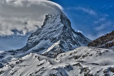 Zermatt scenic view of snowcapped mountains against sky