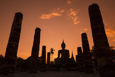 Statue of temple at sunset