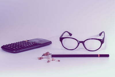 High angle view of sunglasses on table against white background