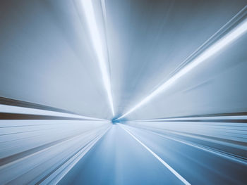 Low angle view of illuminated tunnel
