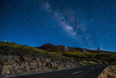 Scenic view of mountains against sky at night