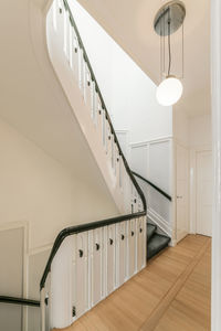 Interior of spacious corridor with staircase on contemporary house designed in minimal style