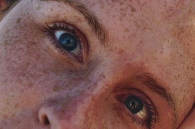 Extreme close-up portrait of young woman