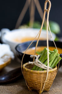 Close-up of basket in bowl on table