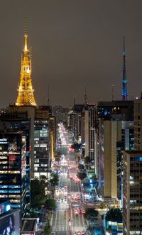 Illuminated buildings in city at night