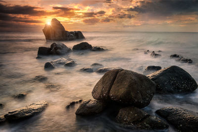 Scenic view of sea against sky during sunset