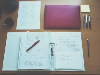 High angle view of file and laptop on table