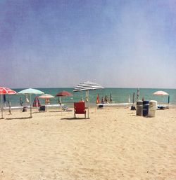 Scenic view of beach against blue sky