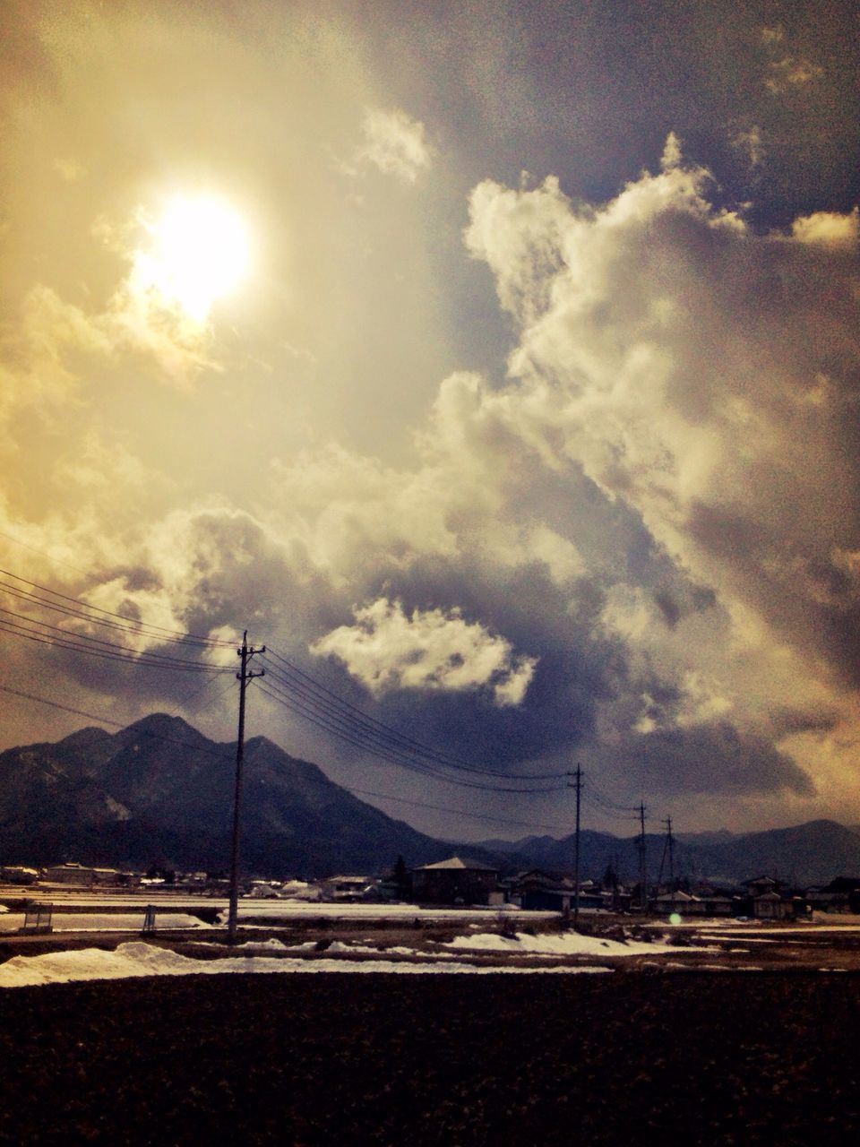 SCENIC VIEW OF MOUNTAINS AGAINST CLOUDY SKY