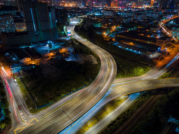 High angle view of light trails on road at night