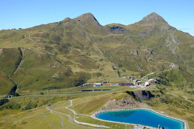 Scenic view of mountains against clear blue sky