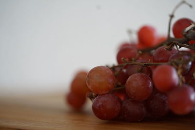 Close-up of grapes on table