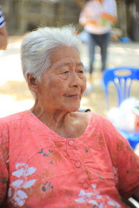 Close-up portrait of a young woman outdoors