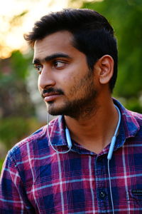 Portrait of young man looking away