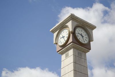 Low angle view of clock tower against sky