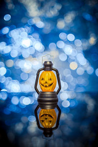 Close-up of lantern on table