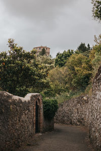 View of old building against cloudy sky