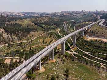 High angle view of road and cityscape against sky