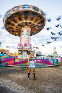 Full length of woman standing against sky