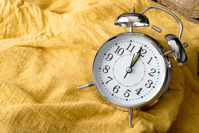 High angle view of clock on table