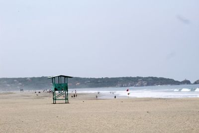 Scenic view of beach against clear sky