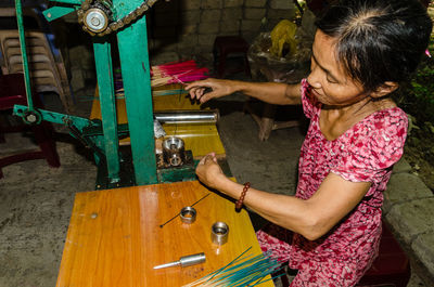 Full length of woman working