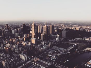 High angle view of modern buildings in city against sky