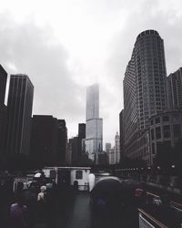 Skyscrapers in city against sky