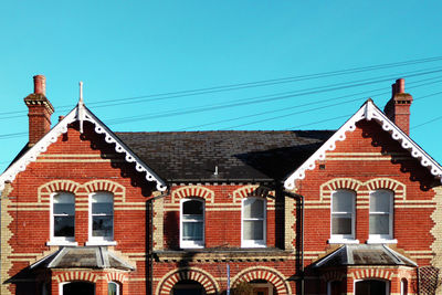 Red house against clear sky