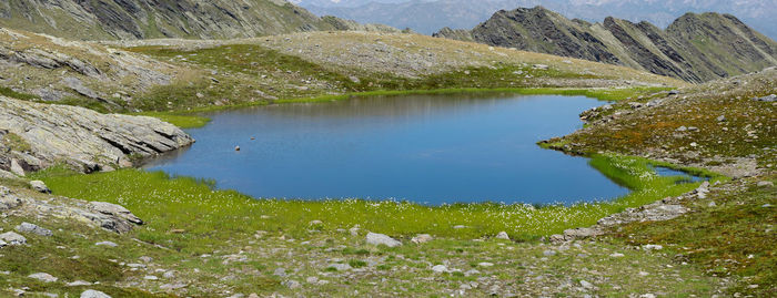 Scenic view of lake by mountains