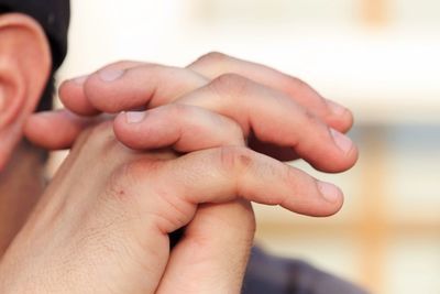 Close-up of hand holding hands