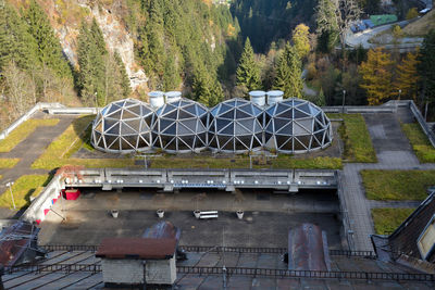 High angle view of bicycles on railing in city