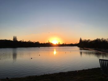 Scenic view of lake against sky during sunset