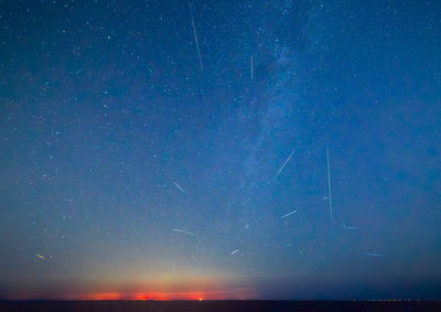 Scenic view of sea against sky at night