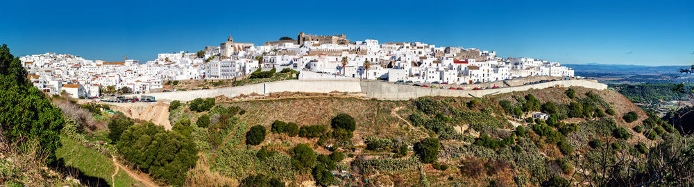 Panoramic view of town against sky
