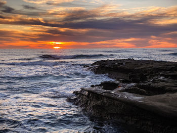 Scenic view of sea against sky during sunset