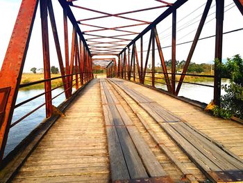 Footbridge against sky