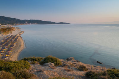 Scenic view of sea against clear sky during sunset