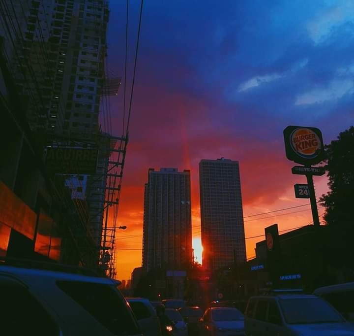 city, mode of transportation, car, architecture, transportation, motor vehicle, built structure, land vehicle, building exterior, sky, street, building, sign, illuminated, road, office building exterior, no people, sunset, dusk, cloud - sky, skyscraper
