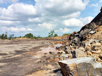 Rocks on land against sky