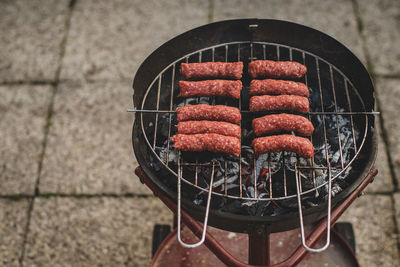 High angle view of meat on barbecue grill