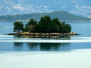 Scenic view of swimming pool by sea against sky