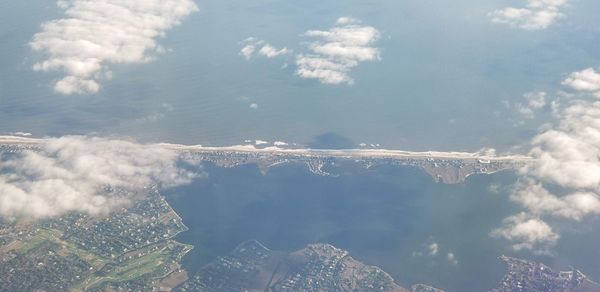 Aerial view of snowcapped landscape against sky