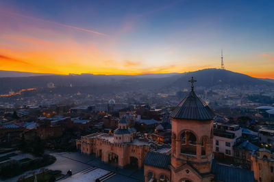 High angle view of city at sunset