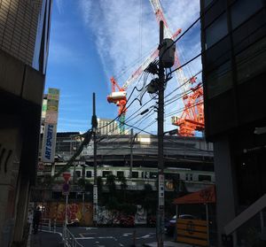 Ferris wheel in city against sky